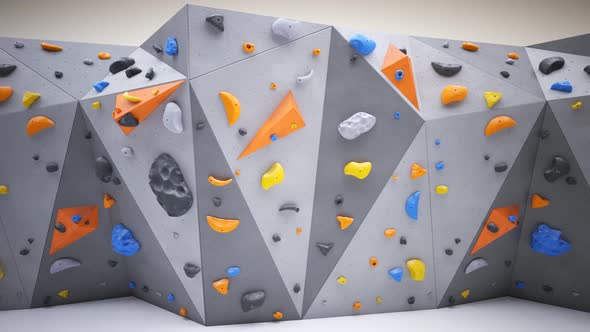 Indoor bouldering wall with colorful climbing holds. Gym indoor extreme training