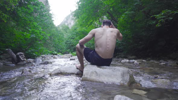 Sitting by the creek and watching nature.