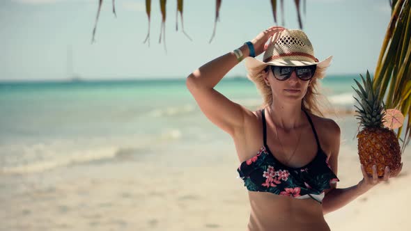 Tanned Woman In Swimsuit Healthy Skin Sunbathing Enjoy Vacation On Ocean. Female Tropical Beach.