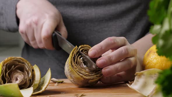 Woman Cut Artichoke