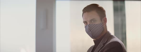 Handsome man wearing textile face mask