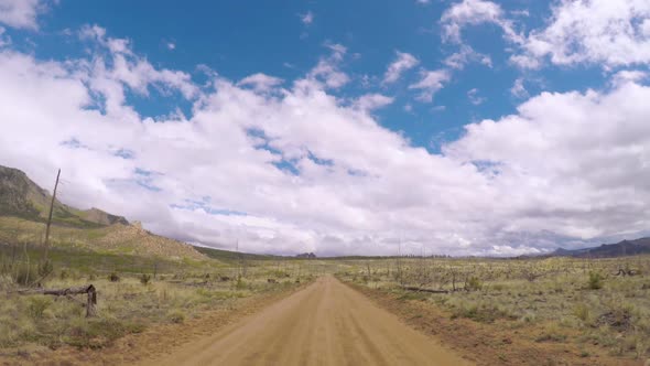 POV point of view -Dirt road in after forest fire area in the mountains near the Cheesman Lake in Co