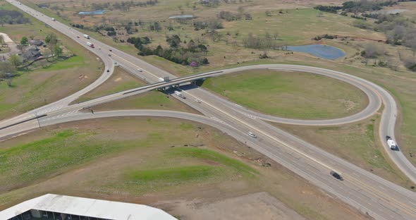 Aerial view of highway transportation with intersection crossing on a bridge in a valley