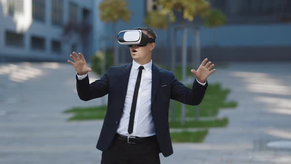 Businessman Touch Something Using Modern 3D VR Glasses Near Office Building