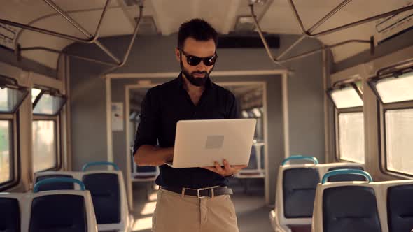 Mobile Worker Typing On Laptop In Train. Freelancer Internet Online Meeting Webinar.