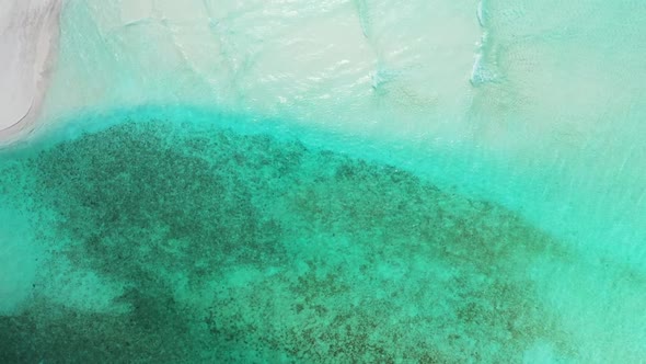 Aerial top down nature of beautiful shore beach journey by clear lagoon with white sandy background 