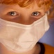 Blond boy with a medical mask on his face against coronavirus - VideoHive Item for Sale