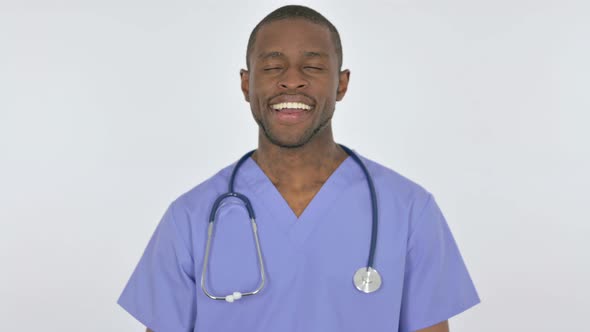 African Doctor Smiling at Camera on White Background