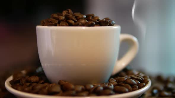 Natural Coffee On A Table In A Coffee Shop. Coffee Smoke From A Cup.