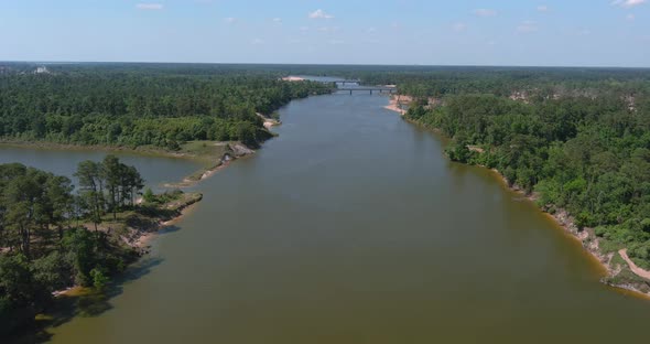 Aerial of cars driving on bridge that crosses over the San Jacinto River in Houston, Texas