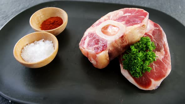 Raw meat chops and ingredients