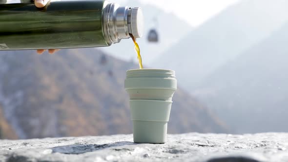Coffee to Go From Thermos at Mountain Resort Cable Car