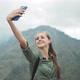 Woman Making Selfie against Mountain - VideoHive Item for Sale