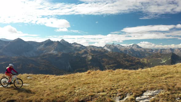 Aerial View Woman Mountain Biking on Ridge