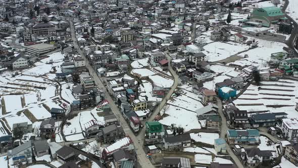aerial top down of nazawa onsen village in nagano japan during early winter with little snow