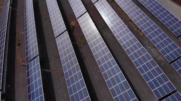 Aerial Shot of a Huge Solar Power Plant in a Big Field. Electricity Generation From Solar Energy