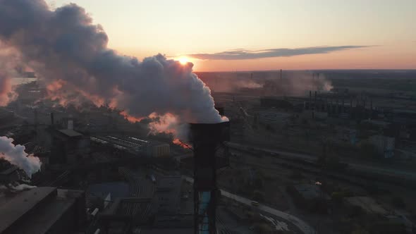 Aerial View. High Chimney Pipe with Grey Smoke. Concept of Environmental Pollution, Climate Change