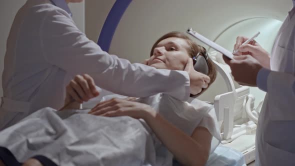 Radiologists Performing Scan on MRI Machine