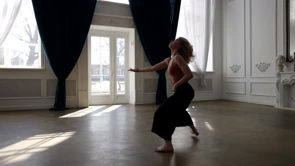 Graceful Female Ballet Dancer is Moving in Rehearsal Hall Modern Choreography