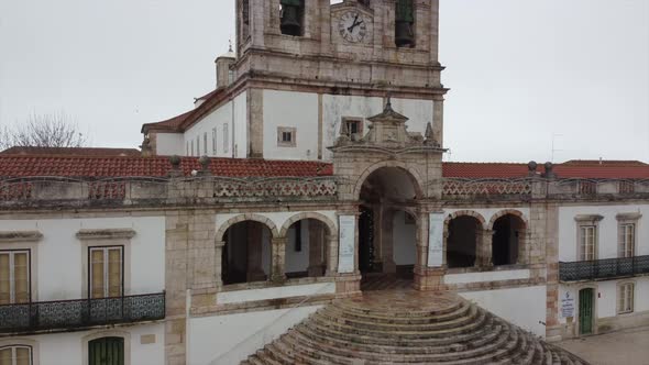 Church of the city of Nazaré in Portugal with the sea in the background, giant waves of Nazaré