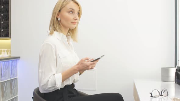 Make-up Artist Having Rest at Her Workplace