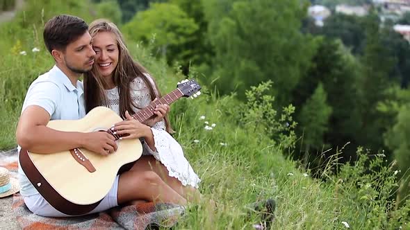 Young Couple In Love On Date Outdoors