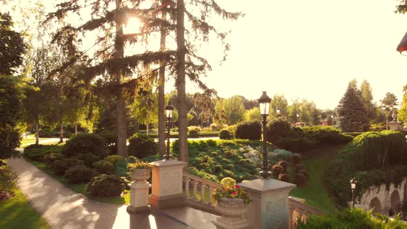 View From a Drone Takingoff in a Summer Park Garden