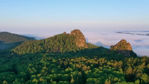 Rocky Peaks in the Fog at Dawn