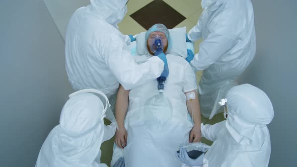 Hospital Workers Running with Coronavirus Patient on Gurney