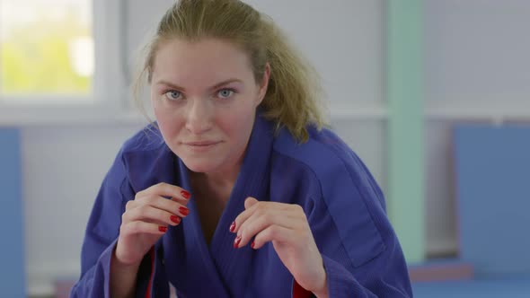 Portrait of Female Jujutsu Athlete in Ready Stance