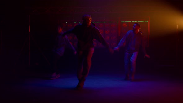 Cool Guys Dancing Hiphop in Flashing Backlights
