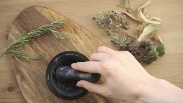 The Women Pounding Spices and Herbs in Mortar for Food Cooking Hold Pestle with Mortar