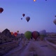 Aerial shot of many hot air balloon flying over idyllic Love Valley in natural park in Cappadocia - VideoHive Item for Sale