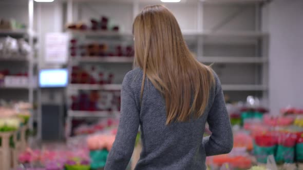 Back View Slim Young Woman Entering Flower Shop Looking Around