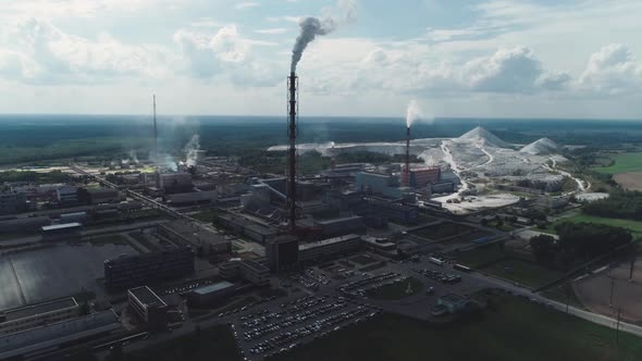 Mining and Processing Plant, View of Pipes and Smoke, Mineral Piles, Mountains of Minerlas and Sand