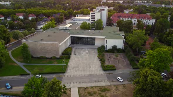 Two students leave the Henry Ford Building.Dramatic aerial view flight subject in of view drone foo