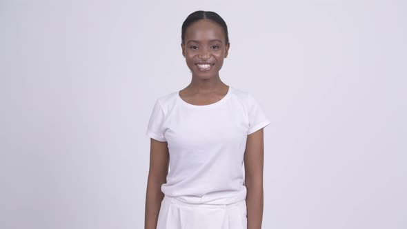 Young Happy African Woman Smiling Against White Background