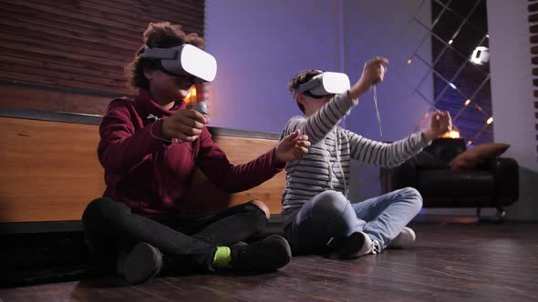 Teenage Boys in VR Headsets Playing Racing Indoors