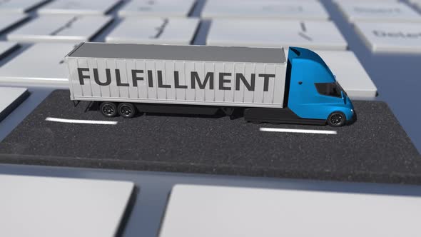 FULFILLMENT Text on the Truck Driving on Keyboard Key