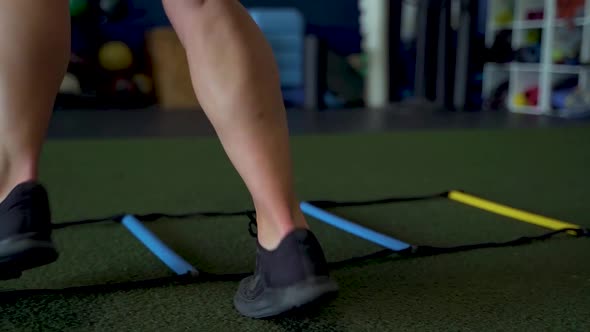 Close up of females feet performing gym ladder sprints