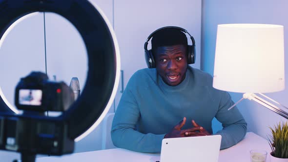 Camera Screen Showing A Man Wearing Headphones Talking While Looking At The Camera