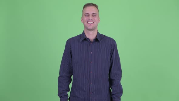 Portrait of Happy Handsome Businessman Smiling