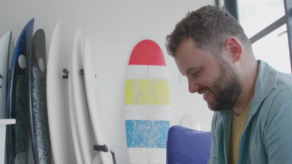 Male surfboard maker in his workshop