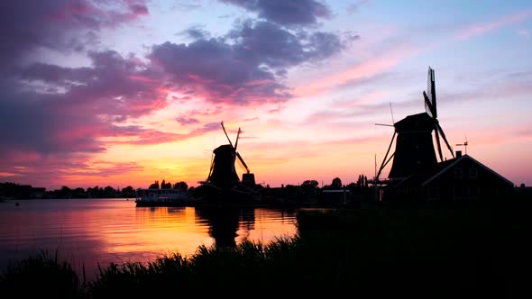 Windmills at Zaanse Schans in Holland on Sunset. Zaandam