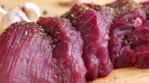 Fresh Raw Beef Meat with Peppercorns Ready To Grill, Rotating