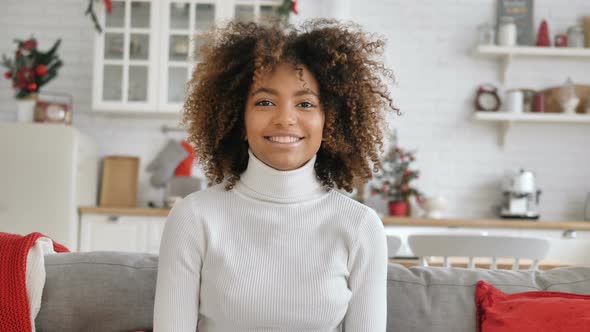 Lady with Perfect Skin and Kinky Hairstyle Smiles Widely