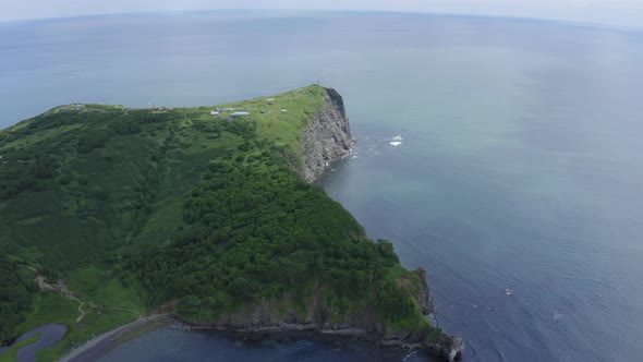 Mayachny Cape on Kamchatka Peninsula on Picturesque Avacha Bay Coast Covered By Green Grass in the