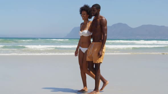 Romantic couple walking together at beach 4k