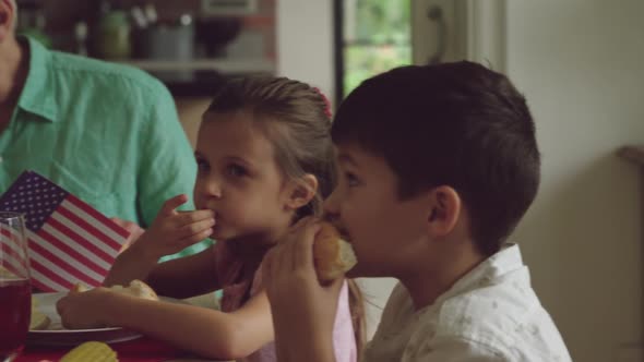 Three generation family eating together