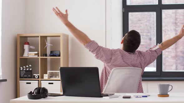 Happy Young Man with Laptop at Office 18